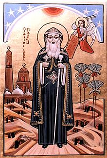 icône représentant un saint devant un décor de désert où se trouve un monastère