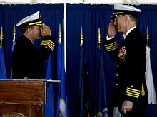 US Navy 051117-N-4776G-077 Capt. James A. Symonds, right, turns over command of the Nimitz-class aircraft carrier USS Ronald Reagan (CVN 76), to Capt. Terry B. Kraft during a change of command ceremony.jpg